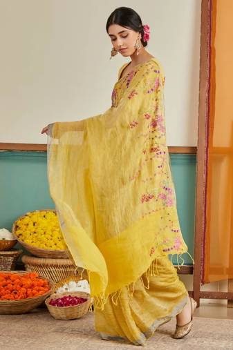 Yellow handloom linen saree with hand embroidered work