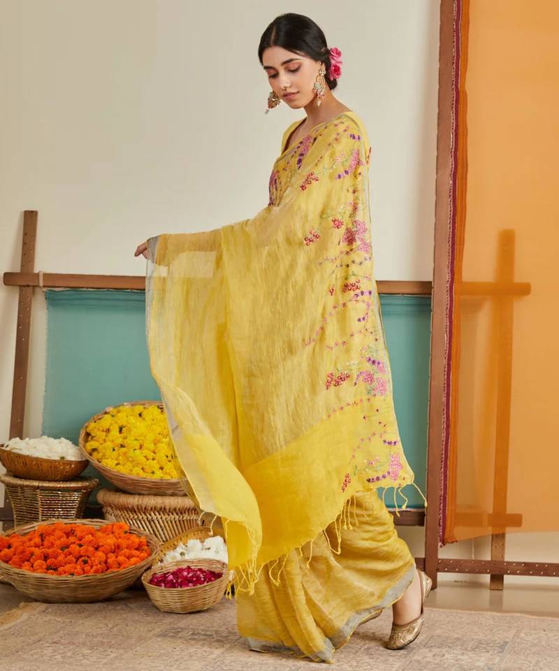 Yellow handloom linen saree with hand embroidered work