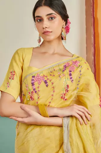 Yellow handloom linen saree with hand embroidered work