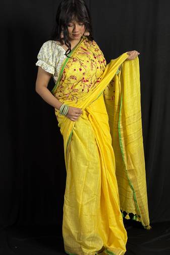 Yellow handloom linen saree with hand embroidered work