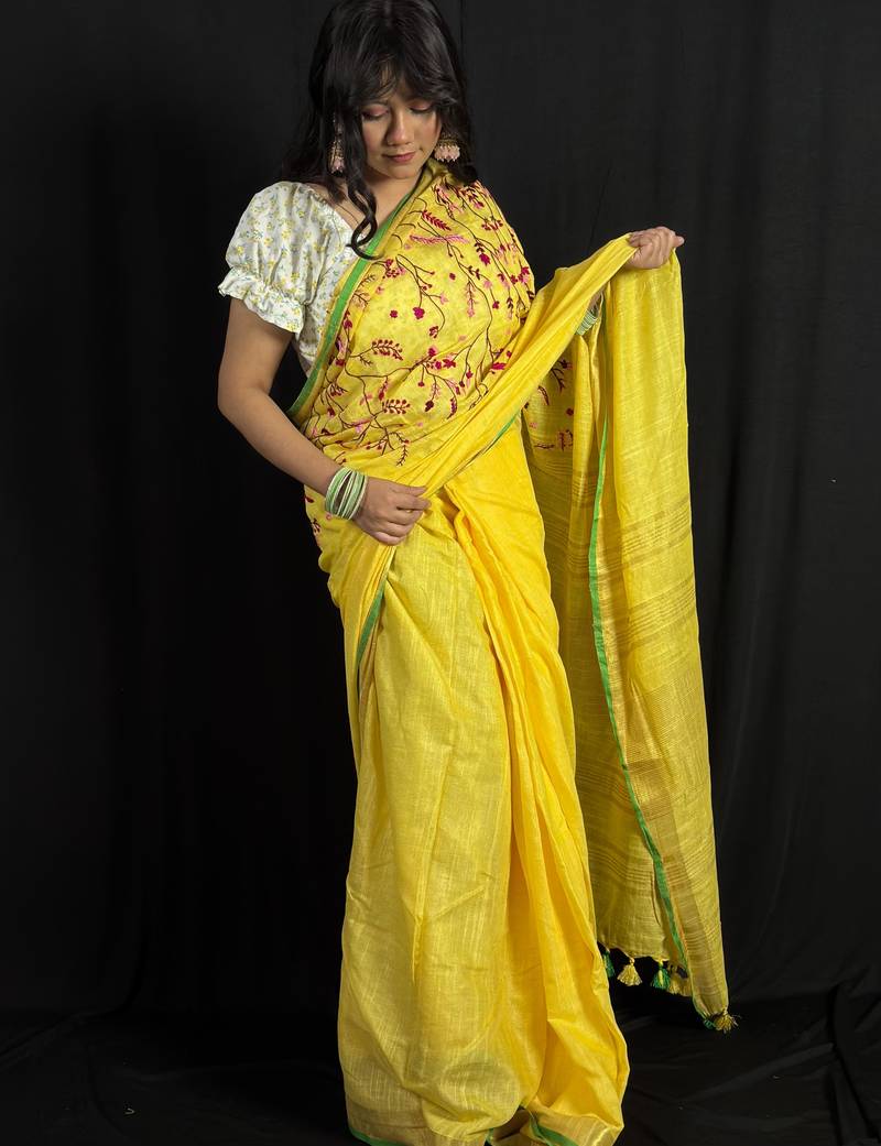 Yellow handloom linen saree with hand embroidered work