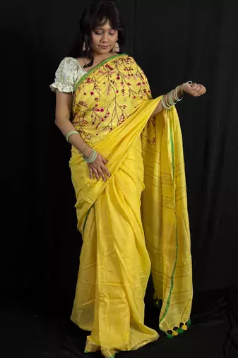Yellow handloom linen saree with hand embroidered work