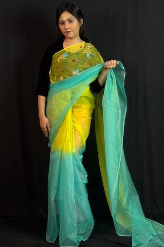 Green organza saree with hand embroidered work