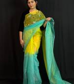 Green organza saree with hand embroidered work