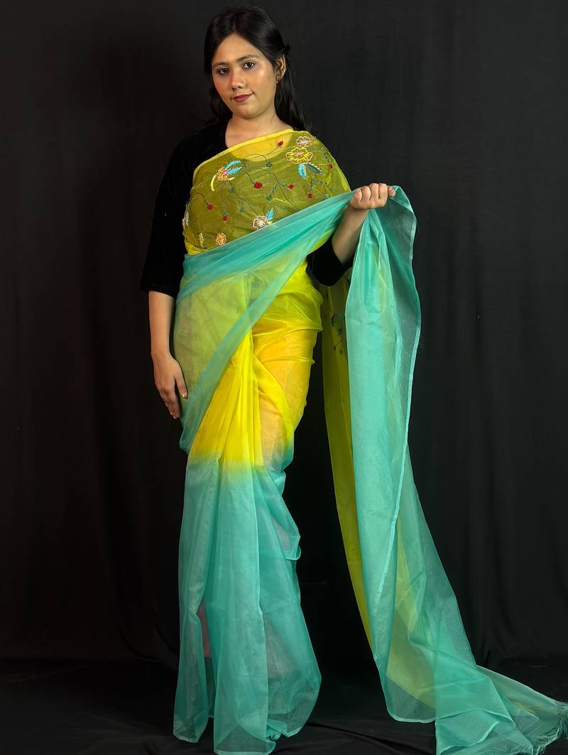 Green organza saree with hand embroidered work