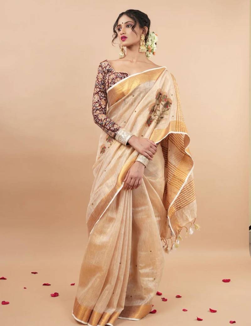 Golden tissue linen saree with hand embroidred work