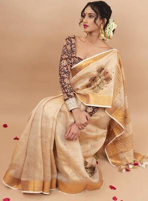 Golden tissue linen saree with hand embroidred work 2
