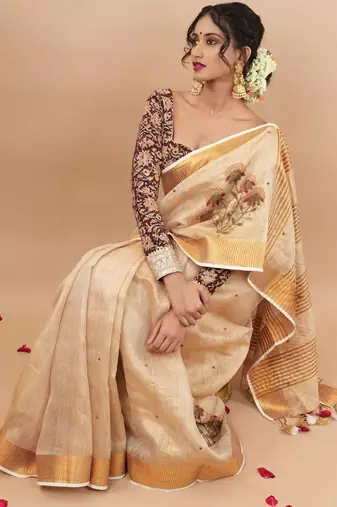 Golden tissue linen saree with hand embroidred work