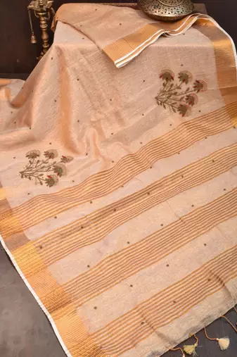 Golden tissue linen saree with hand embroidred work