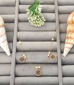 Invisible gold-plated triple pendant necklace with pearl detailing