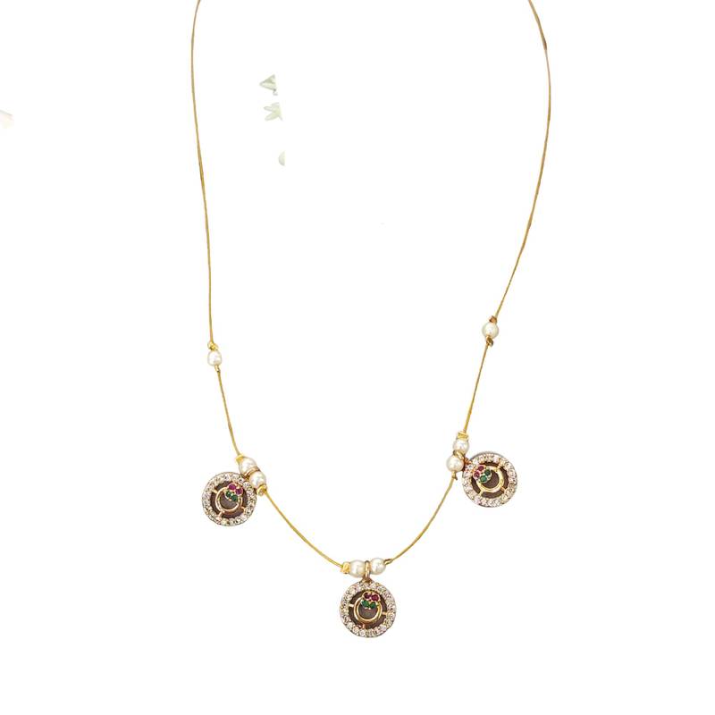 Invisible gold-plated triple pendant necklace with pearl detailing