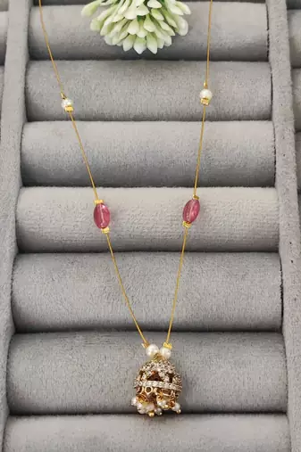 Invisible gold-plated jhumka pendant necklace with pink beads