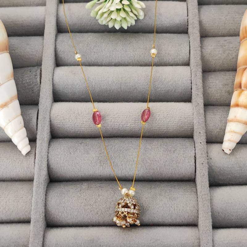 Invisible gold-plated jhumka pendant necklace with pink beads