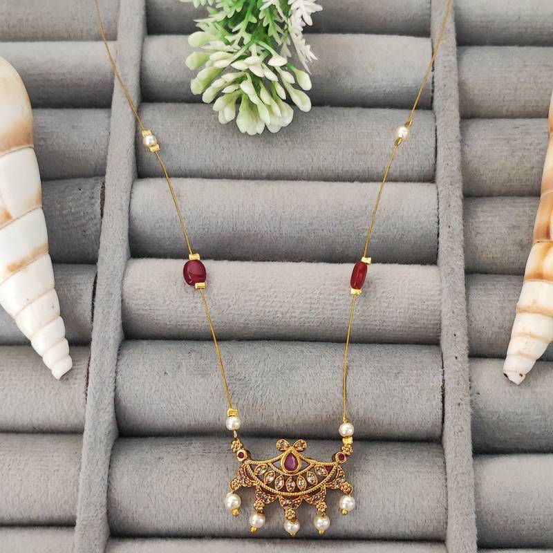 Invisible gold-plated pendant necklace with ruby beads and pearl drops