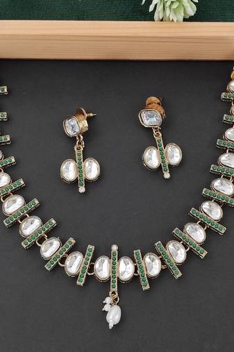 Kundan necklace set with green accents, pearl highlights and matching earrings, perfect for weddings, festive occasions