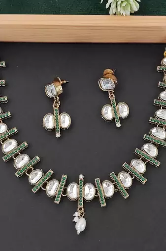 Kundan necklace set with green accents, pearl highlights and matching earrings, perfect for weddings, festive occasions