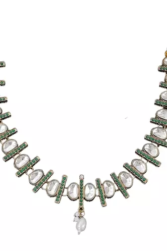 kundan necklace set with green accents and pearl detailing