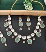kundan style necklace set with emerald green stones
