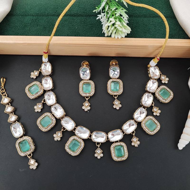 kundan style necklace set with emerald green stones, polki finish, matching earrings,