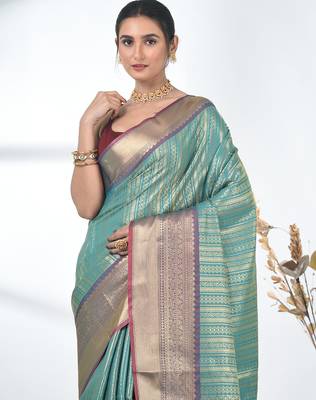 teal brocade saree with intricate borders 5