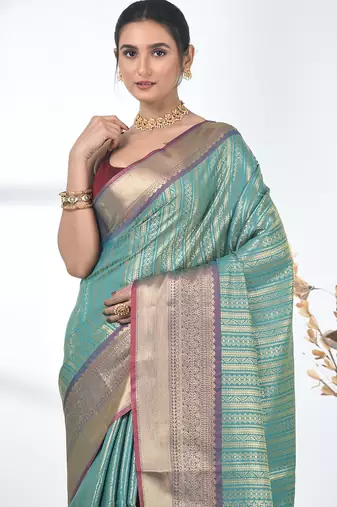 teal brocade saree with intricate borders