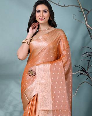elegant orange tissue saree with intricate border 5