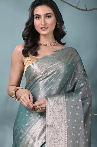 elegant teal tissue saree with intricate border