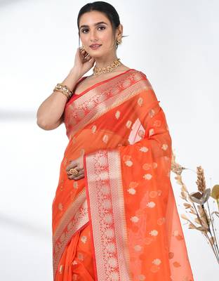orange organza saree with floral motifs and sea green border 5