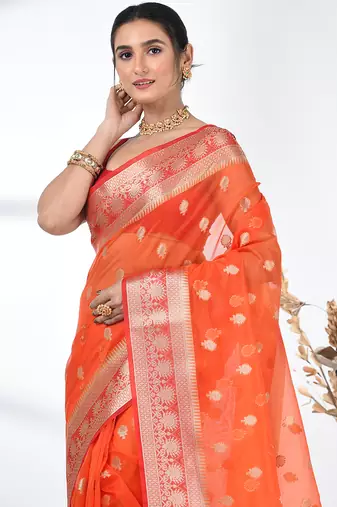 orange organza saree with floral motifs and sea green border