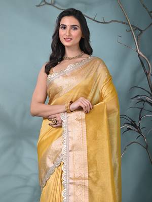 yellow tissue saree with gotapatti detailing and elegant border 5
