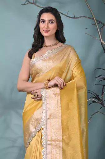 yellow tissue saree with gotapatti detailing and elegant border