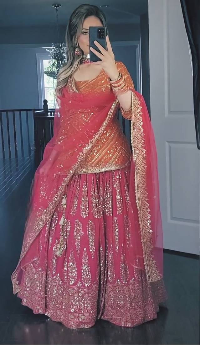 Orange and pink faux georgette embroidered sharara suit