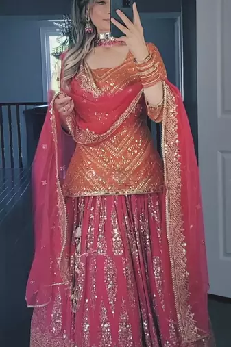Orange and pink faux georgette embroidered Lehenga Choli