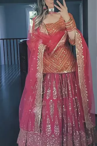Orange and pink faux georgette embroidered Lehenga Choli