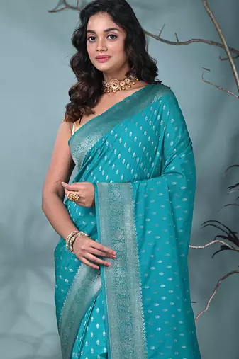 elegant turquoise blue georgette saree with intricate silver zari work
