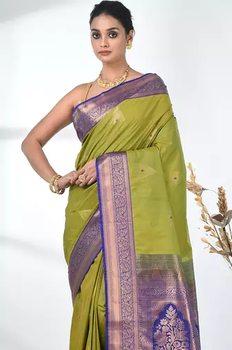 glamorous lime green south silk blend saree with intricate zari border