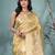 golden tissue saree with intricate embroidery and scalloped border