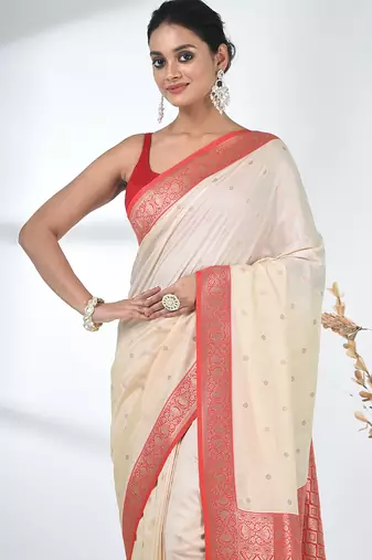 elegant off-white tussar silk blend saree with red zari border