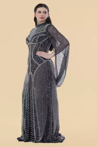 dark blue net backtrail gown with heavy beadwork