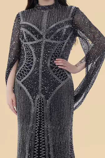 dark blue net backtrail gown with heavy beadwork