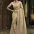 Cream silk blend embroidered saree