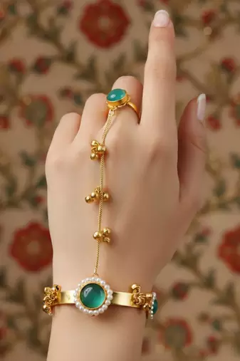 gold-plated mint kundan hathphool with floral design