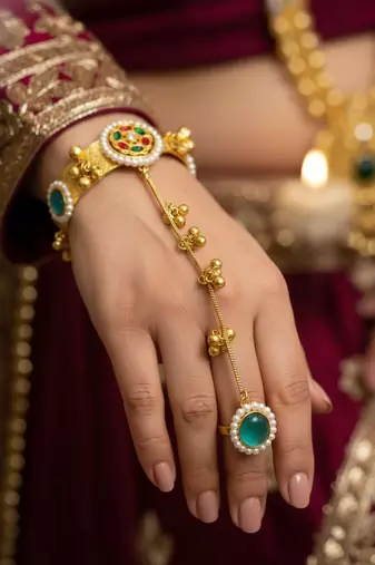 mint gold-plated kundan hathphool with floral design