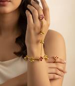 gold-plated kundan floral hathphool with ruby stones