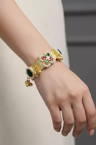 green gold-plated kundan hathphool with floral design