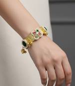 green gold-plated kundan hathphool with floral design