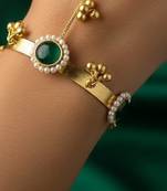 green gold-plated kundan hathphool with floral design