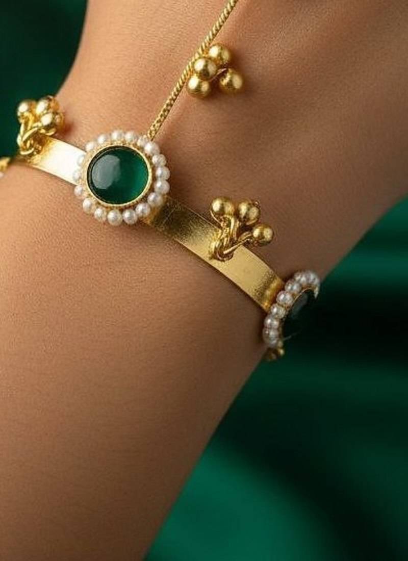 green gold-plated kundan hathphool with floral design