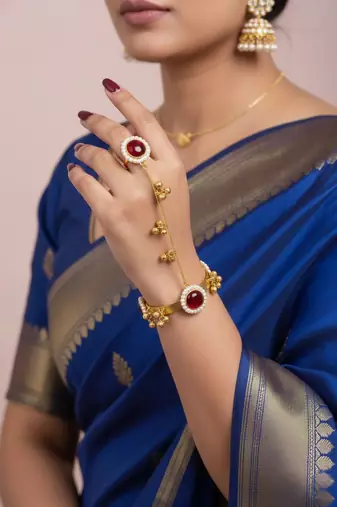 gold-plated kundan floral hathphool with ruby stones