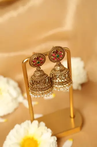 gold plated jhumka earrings with pearl drop design